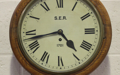 A George V South Eastern Railway oak cased drop dial wall timepiece with eight day chain driven sing