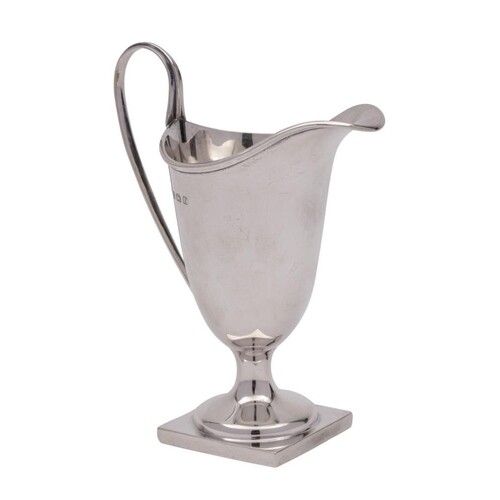 A George V silver cream jug, maker William Aitken, Birmingha...