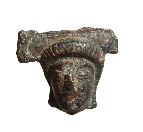 A Greek bronze head of a woman or goddess