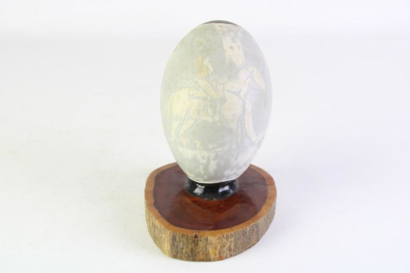 A Hand Painted Emu Egg Titled "The Boundary Rider"By Brian Irving Guyra NSW Mounted on Organic wooden Base