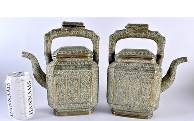 A LARGE PAIR OF 19TH CENTURY INDIAN BRONZE TEAPOTS AND COVER...
