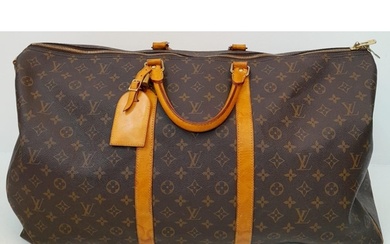A Large Louis Vuitton Keepall Travel Bag. Monogram LV canvas...