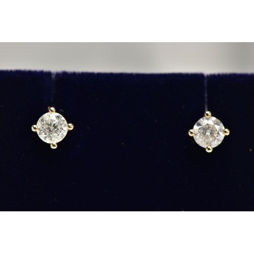 A PAIR OF 9CT GOLD DIAMOND STUD EARRINGS, each fitted with a...