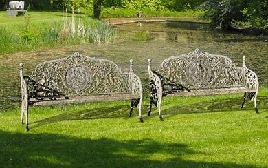 A PAIR OF CONTINENTAL CAST IRON GARDEN BENCHES IN 19TH CENTURY STYLE, MID 20TH CENTURY, AFTER THE