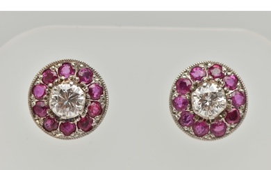 A PAIR OF DIAMOND AND RUBY EARRINGS, designed as a round bri...