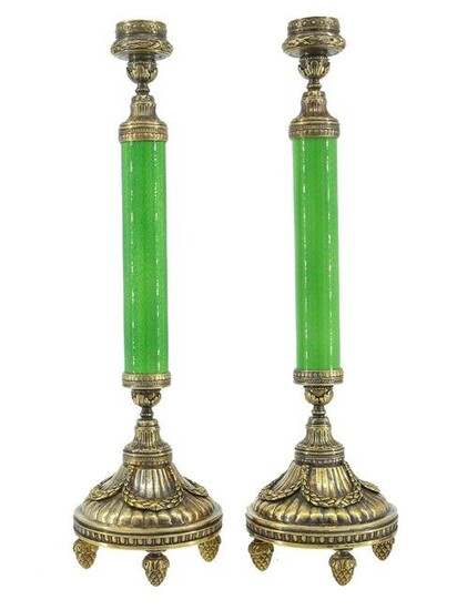 A PAIR OF RUSSIAN SILVER AND ENAMEL CANDLE STICKS
