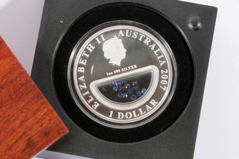A Queen Elizabeth II (2007) 1 oz pure silver Dollar "Treasures of Australia" with Sapphire Inserts by The Perth Mint, coin no.4289/7500