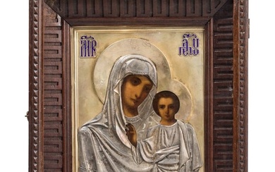 A Russian icon showing the Kazanskaya Mother of God with silver-gilt oklad and kiot, circa 1900