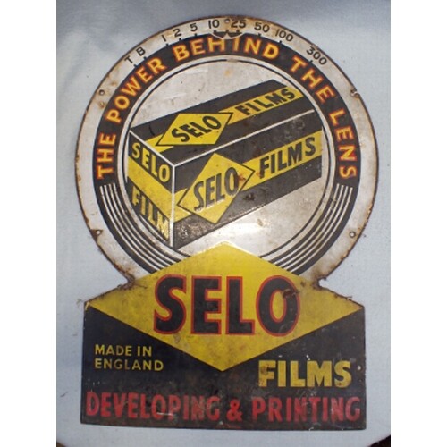 A 'SELO FILMS' PHOTOGRAPHY ENAMEL ADVERTISING SIGN in the f...