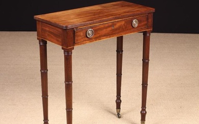 A Small Mahogany George IV Mahogany Side Table. The top having reeded edges above a frieze drawer wi
