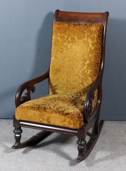 A Victorian Mahogany Framed Scroll Back Rocking Chair, the...