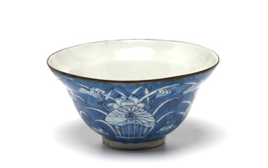 A blue and white porcelain covered teacup painted with mandarin ducks among lotus flowers on blue ground