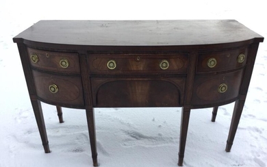 A bowfronted mahogany sideboard, the crossbanded top inlaid with...