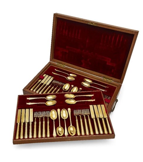 A boxed canteen of silver-gilt cutlery by...