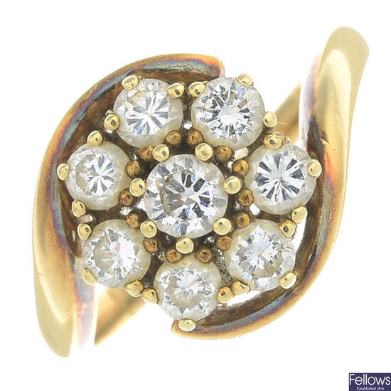 A brilliant-cut diamond cluster ring.