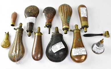 A collection of 19th century and later powder flasks including...