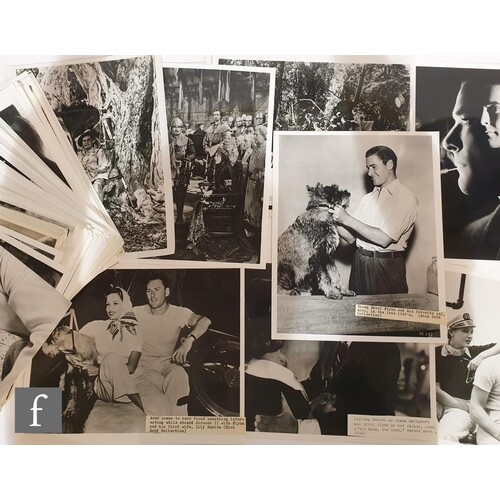 A collection of Errol Flynn publicity and film stills to inc...