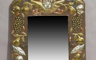 A continental brass and copper mirror, late 20th century, with various fruit and foliage decoration, 109cm x 68cm