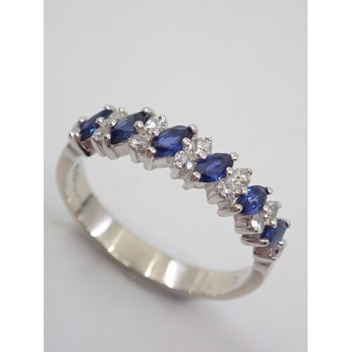 A diamond and sapphire half eternity ring, set in 14k gold, ...