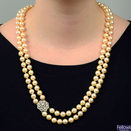 A cultured pearl two-row necklace, with 9ct gold diamond cluster clasp.