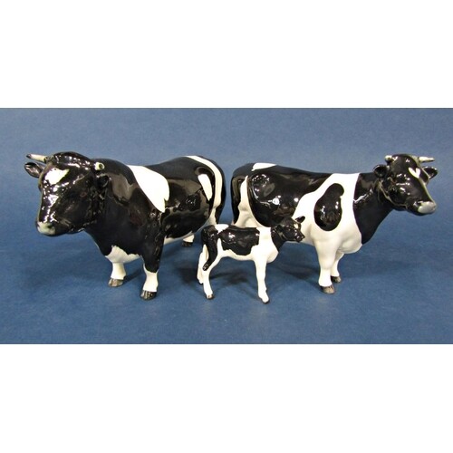 A family of three Beswick Friesian cattle comprising bull, c...