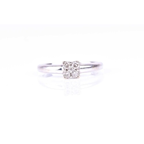 A five stone diamond cluster ring, the round brilliant cut d...