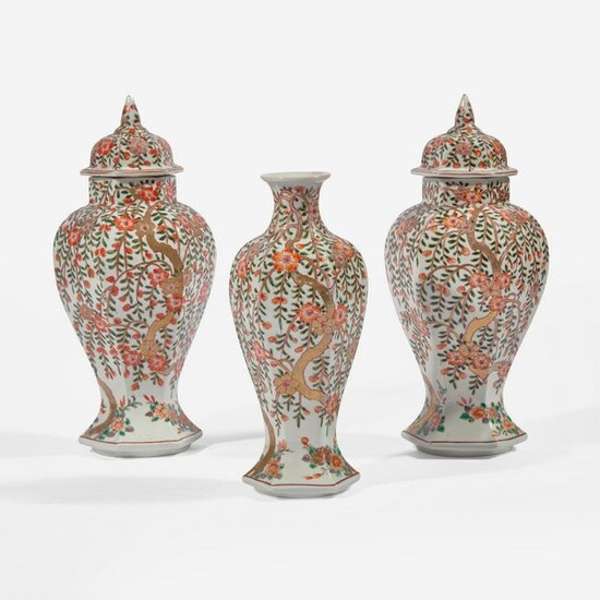 A garniture of three Japanese baluster jars and a vase