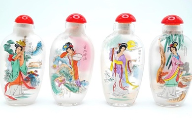 A group of four Peking glass snuff bottles with...