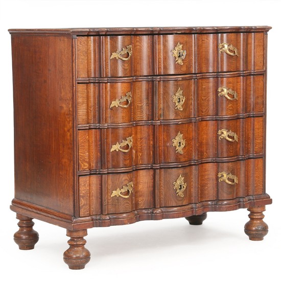 A large Danish Baroque waxed oakwood chest of drawers with ball-feet. Mid 18th century. H. 105 cm. W. 112 cm. D. 60 cm.