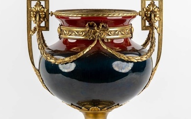 A large faience vase mounted with gilt bronze in Louis XV style. Circa 1900. (L:34 x W:40 x H:50 cm)