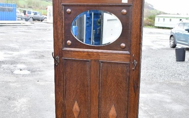 A late 19th or early 20th Century oak hall stand in the Jacobean revival style with Art Nouveau
