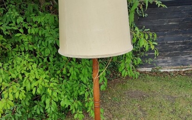 NOT SOLD. A mahogany floor lamp. C. 1920. H. 170. Shade Diam. app. 45 cm....