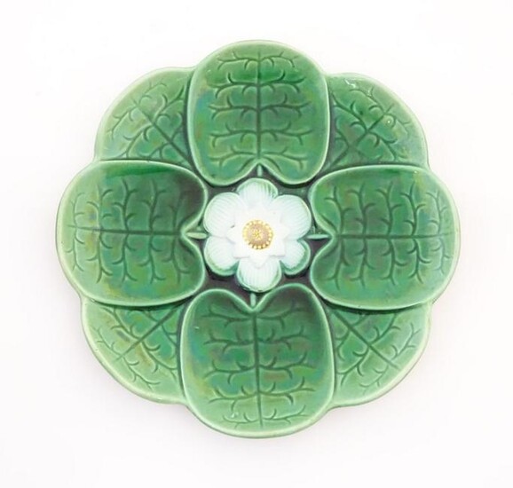 A majolica plate with stylised water lily flower