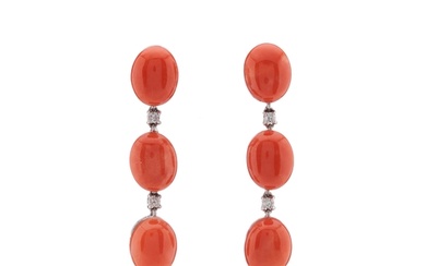 A pair of 18ct gold oval coral cabochon three-stone articula...