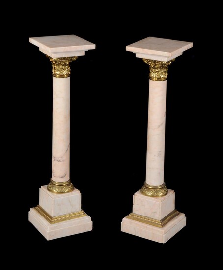 A pair of Continental mottled pink marble and gilt bronze mounted columns