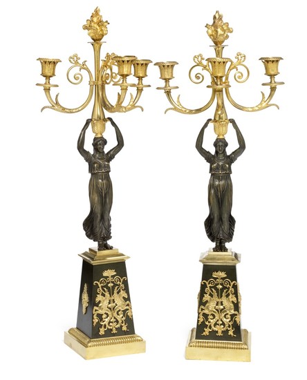 A pair of French Empire gilt and patinated bronze candelabra. Early 19th century. H. 65 cm. (2)