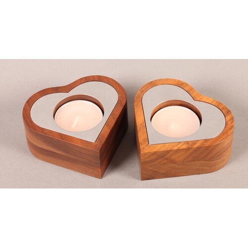 A pair of Linley walnut and polished steel tealight holders ...