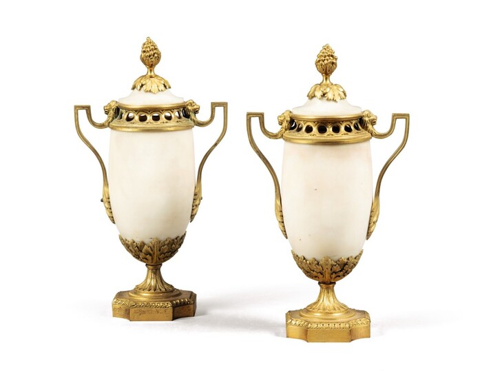 A pair of Louis XVI gilt-bronze-mounted white marble vases and covers, possibly Italian