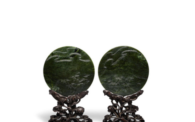 A pair of circular spinach jade plaques