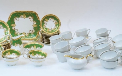 A porcelain part service, by Bishop & Stonier, early 20th century, comprising: two rectangular dishes, 25cm wide; a milk jug, 12cm high; seven tea cups, 10cm diameter; twelve saucers; nine side plates; and a sugar bowl, 12cm diameter; together with...