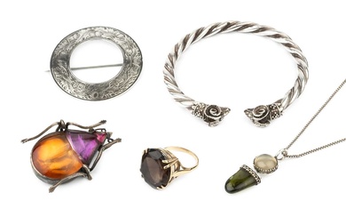 A quartz dress ring, the oval cut stone claw set...