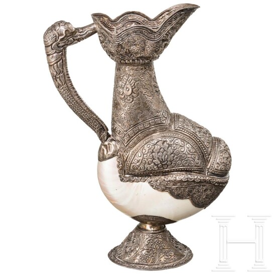 A remarkable Tibetan or Nepalese silver mounted nautilus jug, circa 1900