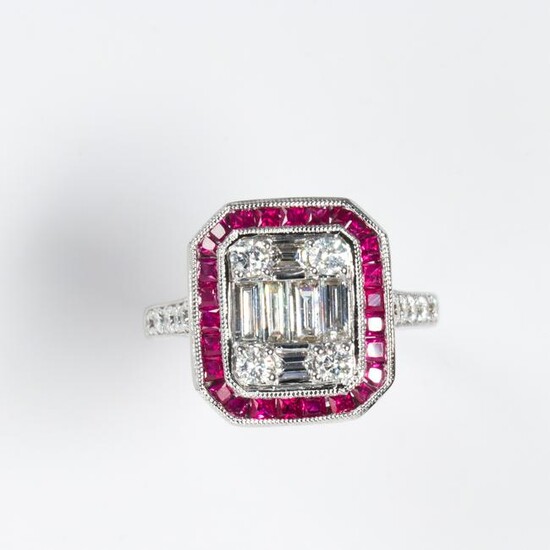 A ruby, diamond and eighteen karat white gold ring