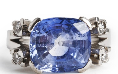A sapphire and diamond ring set with a modified square-cut natural sapphire...