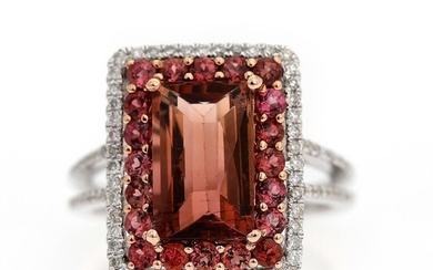SOLD. A tourmaline and diamond ring set with a tourmaline weighing app. 3.47 ct. encircled...