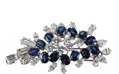 A white gold sapphire and diamond clip brooch