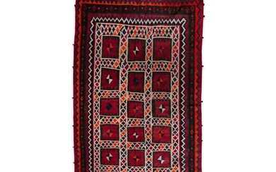 AN IRANIAN RED GROUND WOOL RUG, CA 1940s, 288 x 168cm the c...