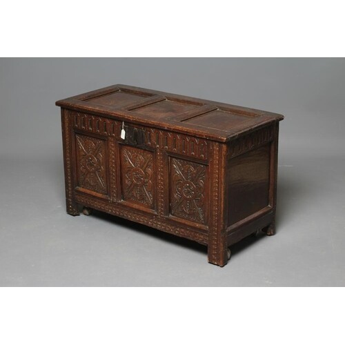 AN OAK PANELLED COFFER, early 18th century, the hinged lid o...