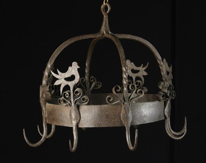 An 18th Century Style Wrought Iron Game Hanger with eight hooks attached to a circular hoop surmount