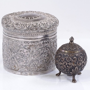 An Eastern circular silver box, with relief embossed grapevi...